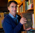 Crispin Clarke ’98 holds his volume of Shakespeare's works